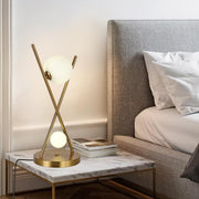 Gold X-Shaped Table Lamp with Globe Glass Shades